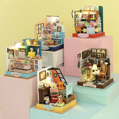 a group of small toy houses sitting on top of each other